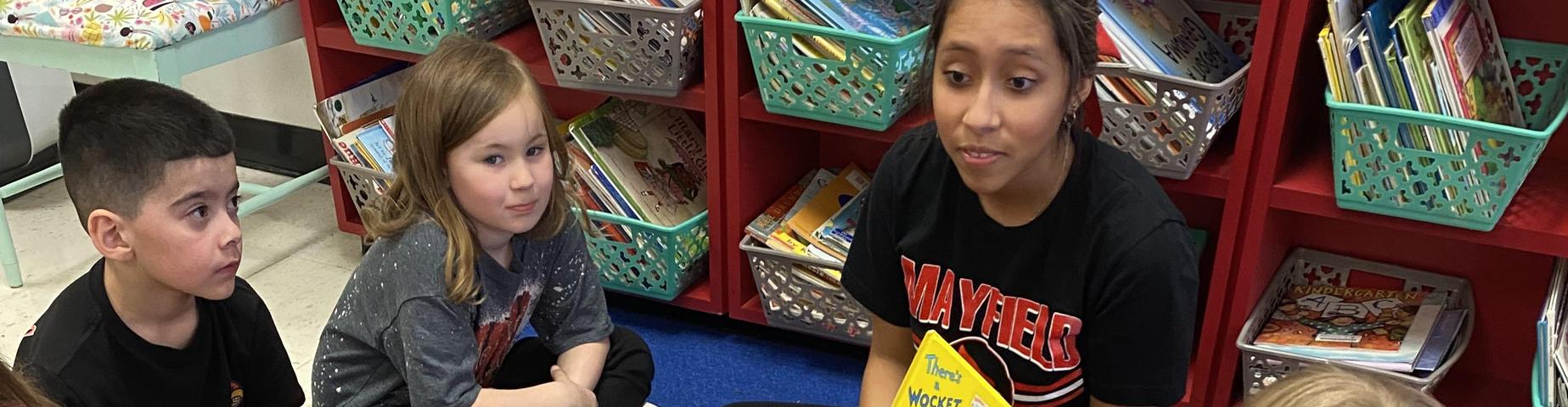 MES students loved having MHS students in their class reading books.