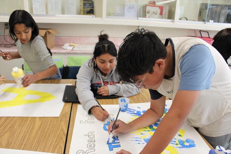 Leadership students creating a banner