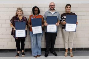 The transportation team poses with their certificates