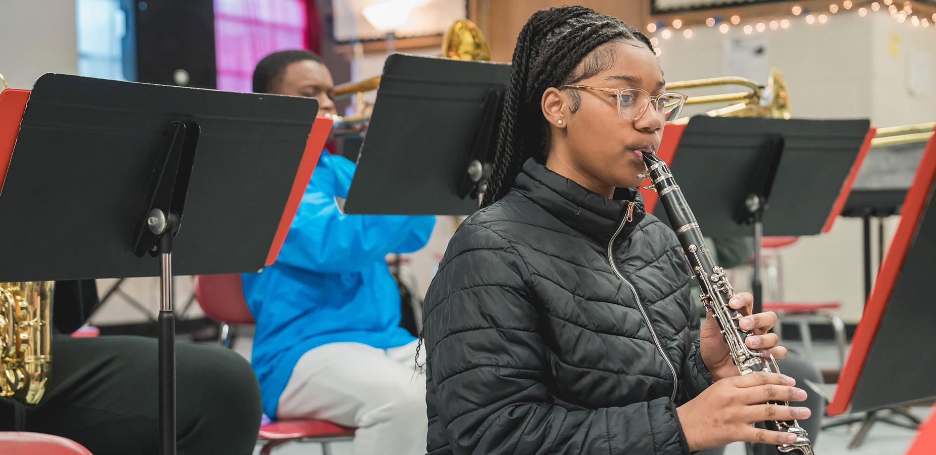high school student playing clarinet