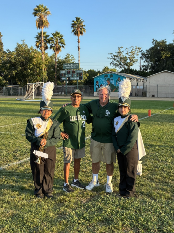 Nogy with band members on field