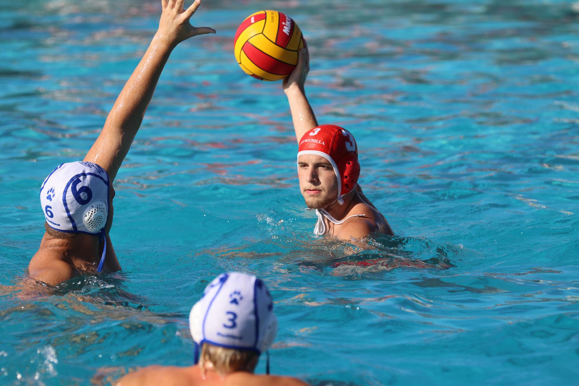 boys playing water polo against Madera