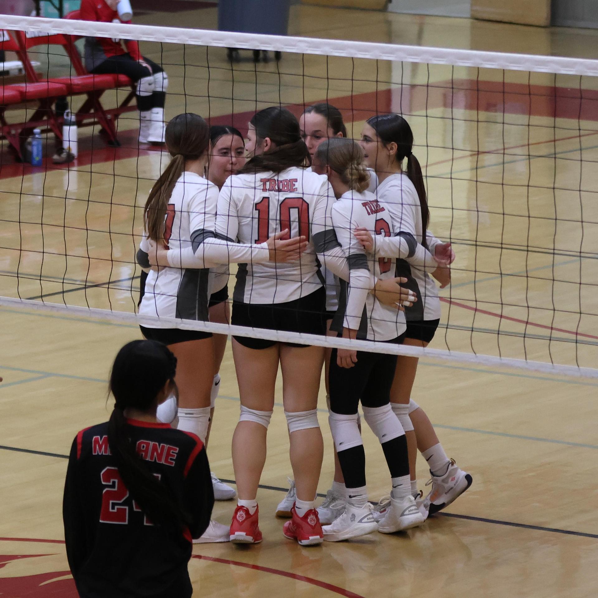 junior varsity girls playing volleyball 129