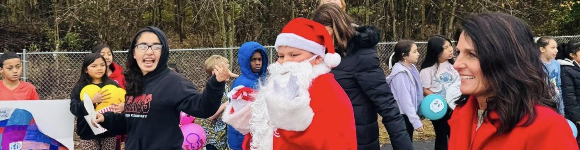 A student dressed as Santa in the parade.