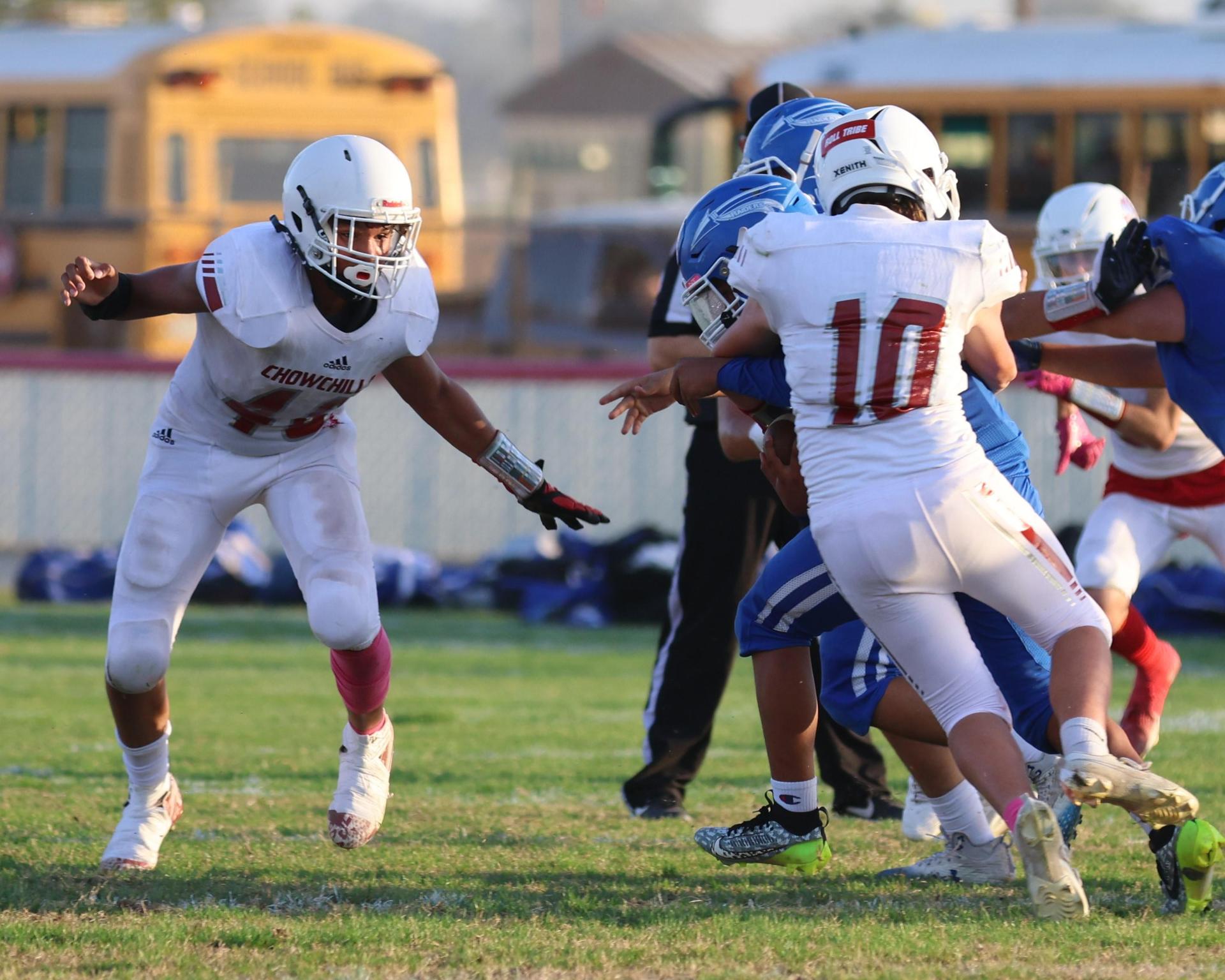 Junior Varsity football players in action against Caruthers