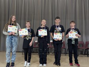 NCSD Spelling Bee winners holding certificates for group photo