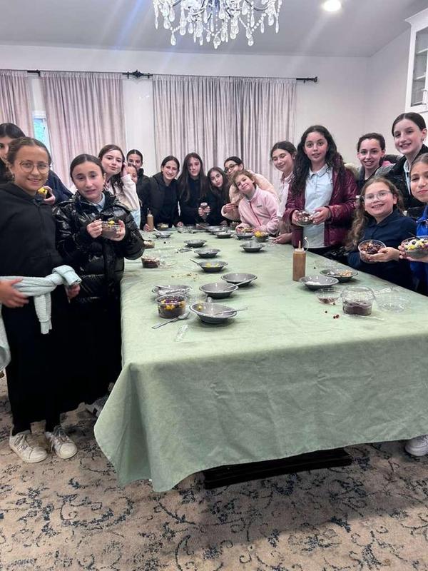 The sixth grade girls pose with their Acai Bowls