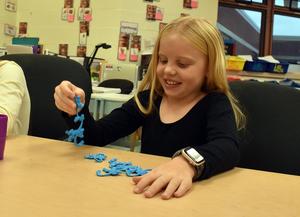 Students playing with a Barrel of Monkeys