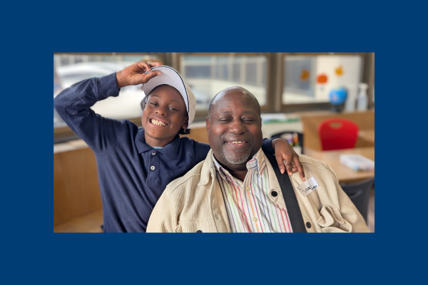 Family matters at Center School. Student with grandparent in class.