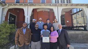 MACS Staff with the awarded student, Lateef Jenkins and his family