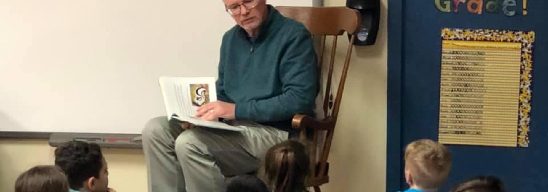 Mr. Jones reading to children