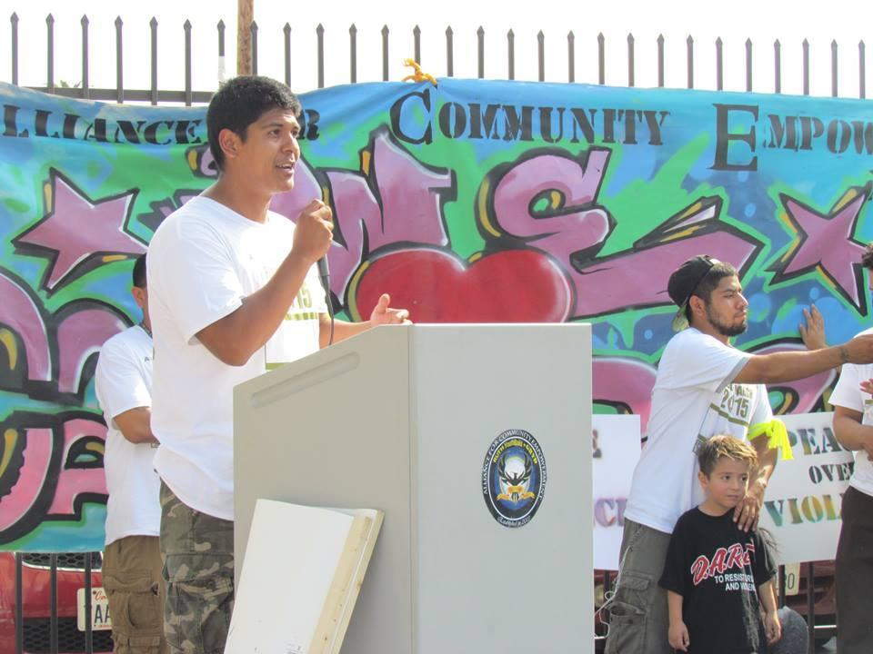 student speaks at a podium during Peace March