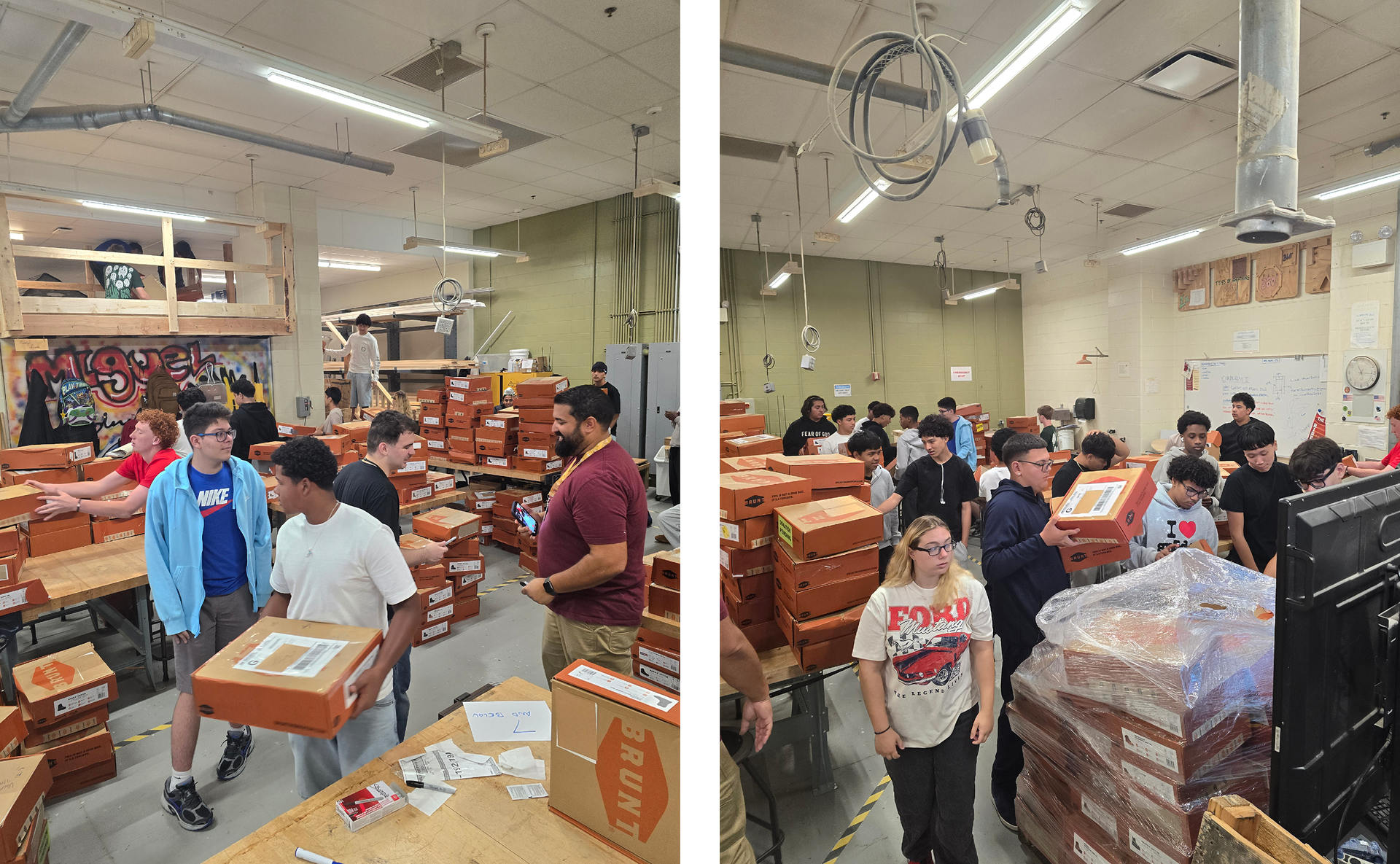 Students carrying orange boxes in a classroom filled with activity.