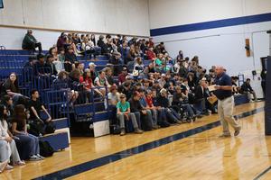 Principal Brian Spadafino addresses freshmen gathered in the gym