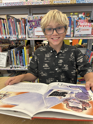 student reading in library