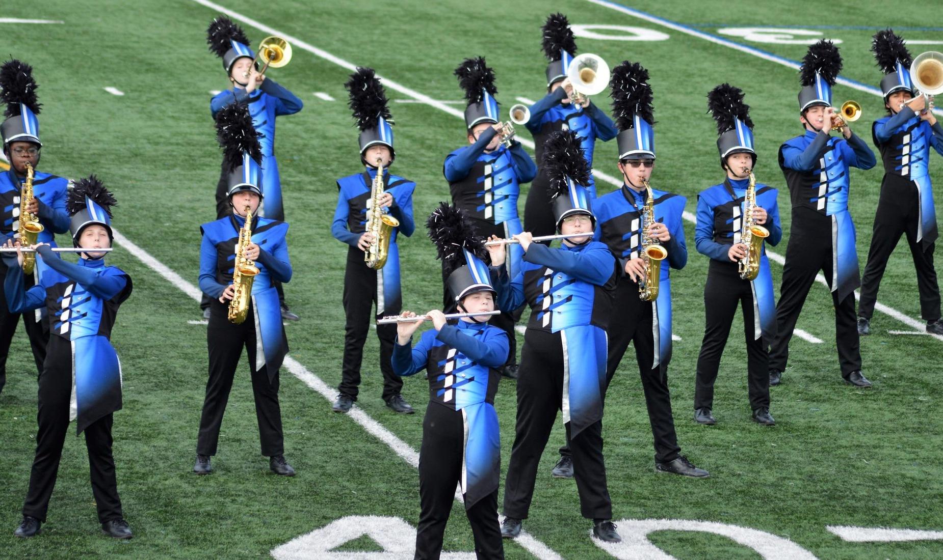 Marching Band members on field playing