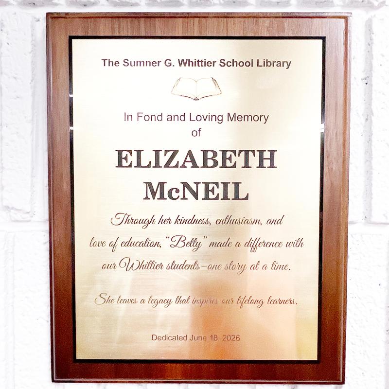 Memorial plaque for Elizabeth McNeil at the Sumner G. Whittier School Library.