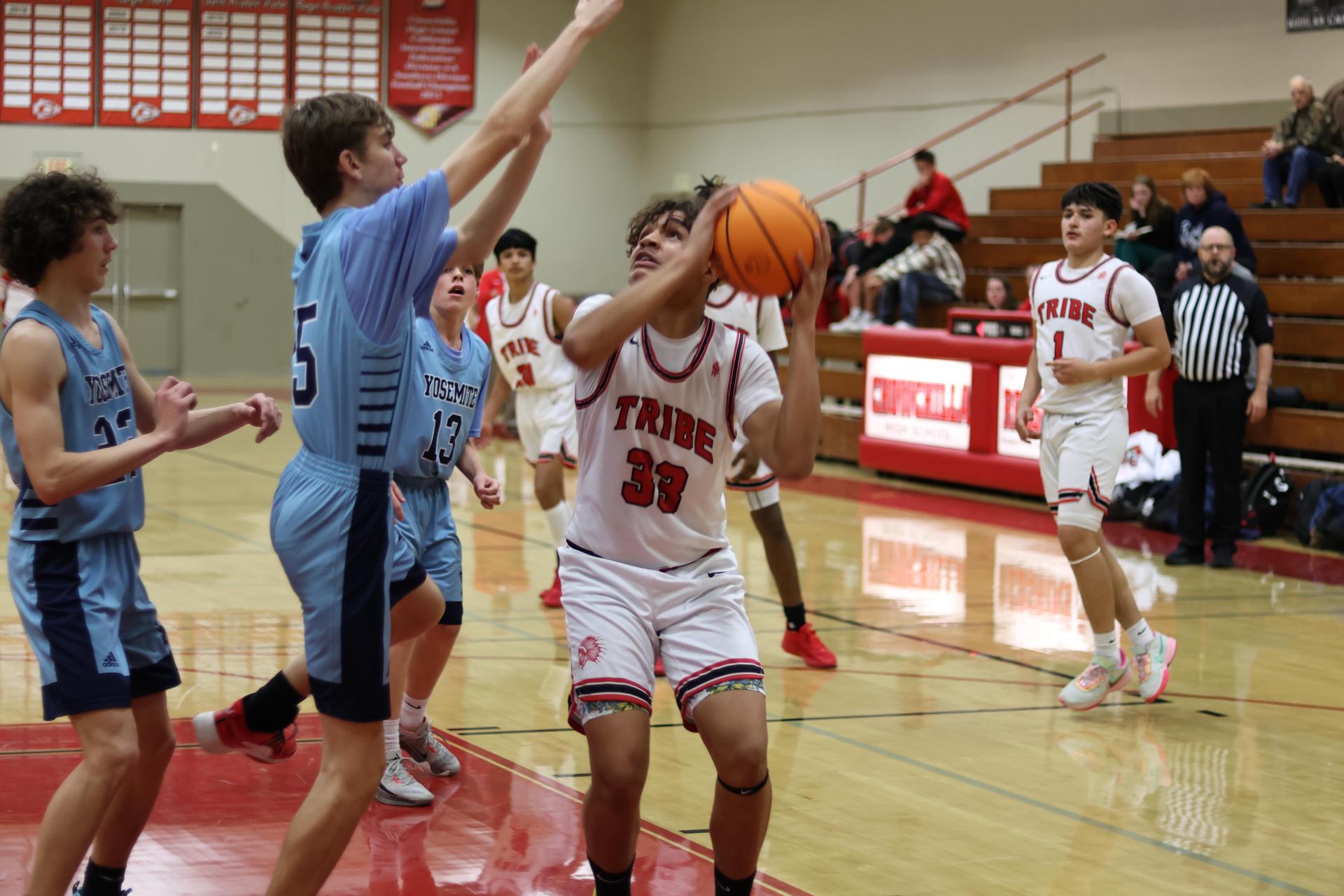 junior varsity boys playing basketball against yosemite