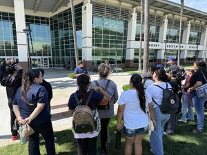 A picture of the group listening to a tour guide at Cal Sate Fullerton.