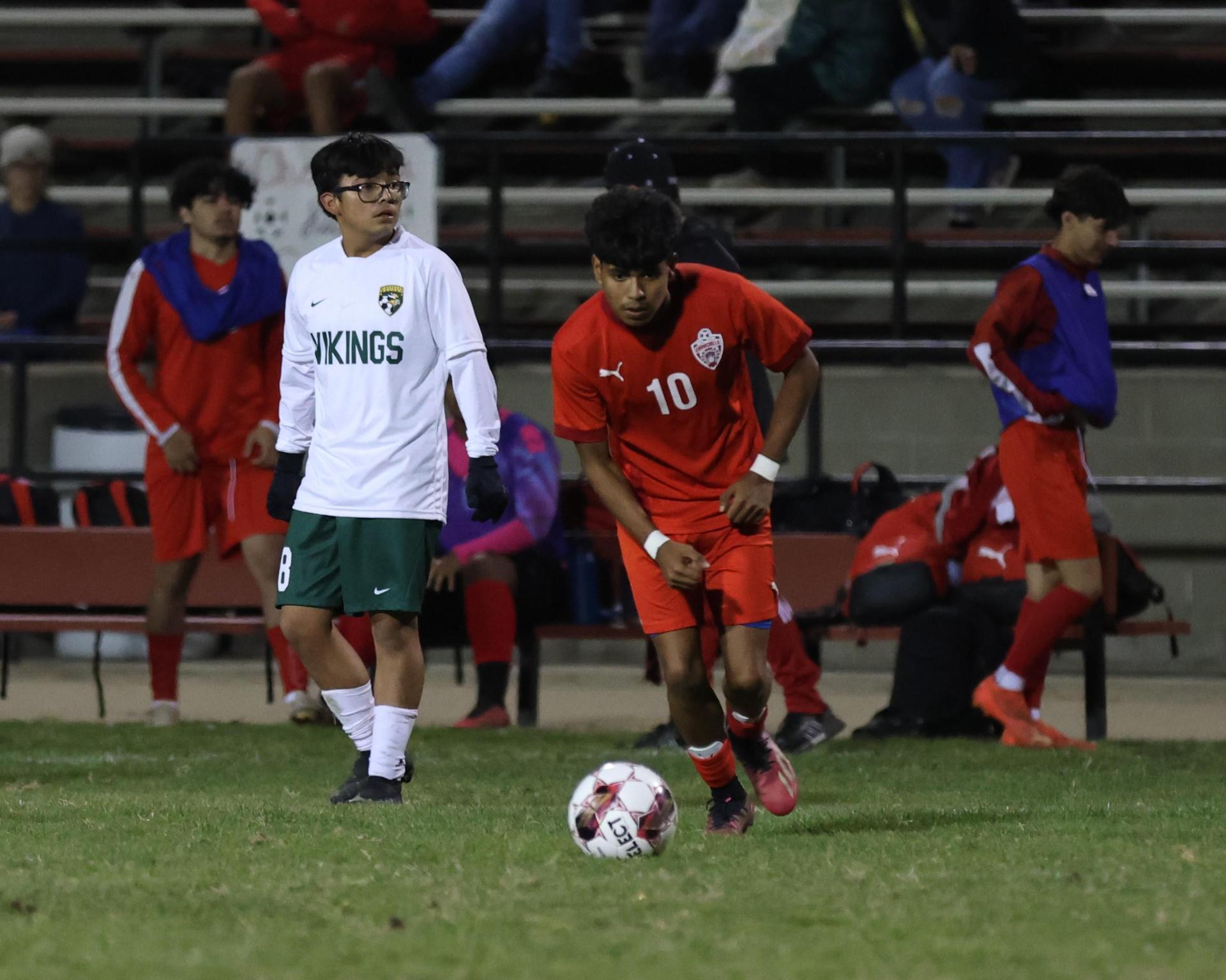 Varsity boys play soccer against Kingsburg
