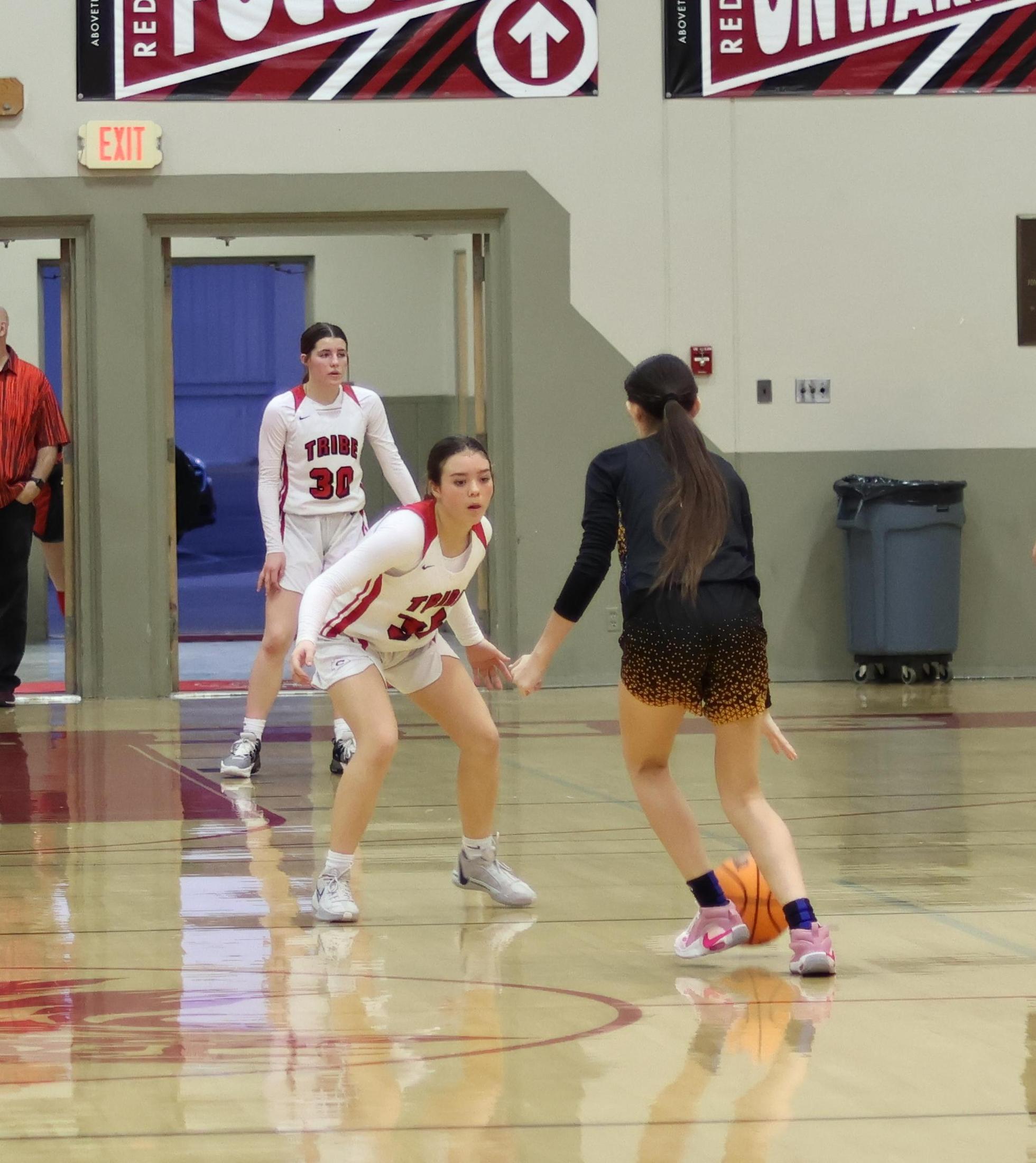 junior varsity girls playing basketball against parlier