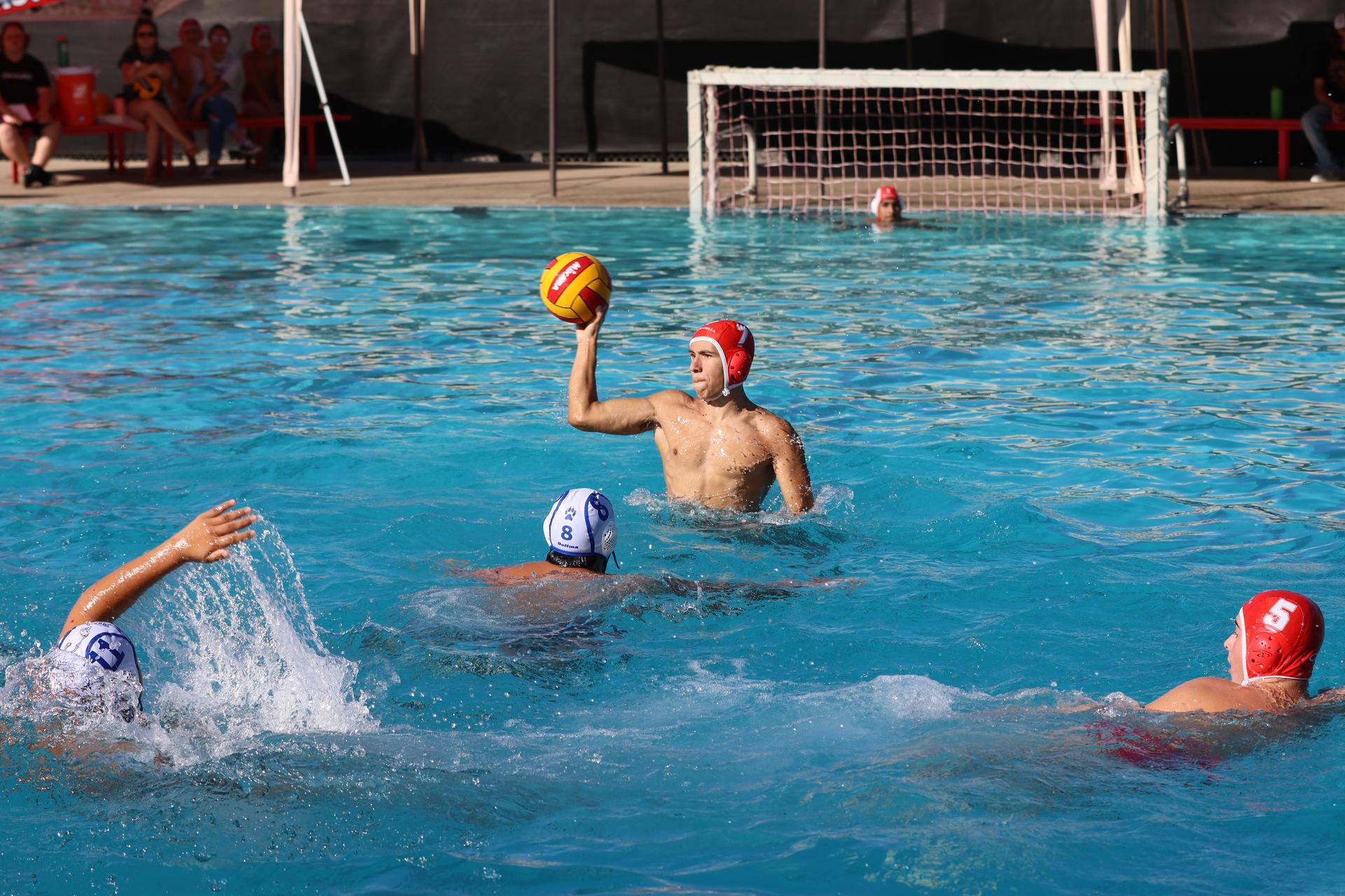 boys playing water polo against Madera