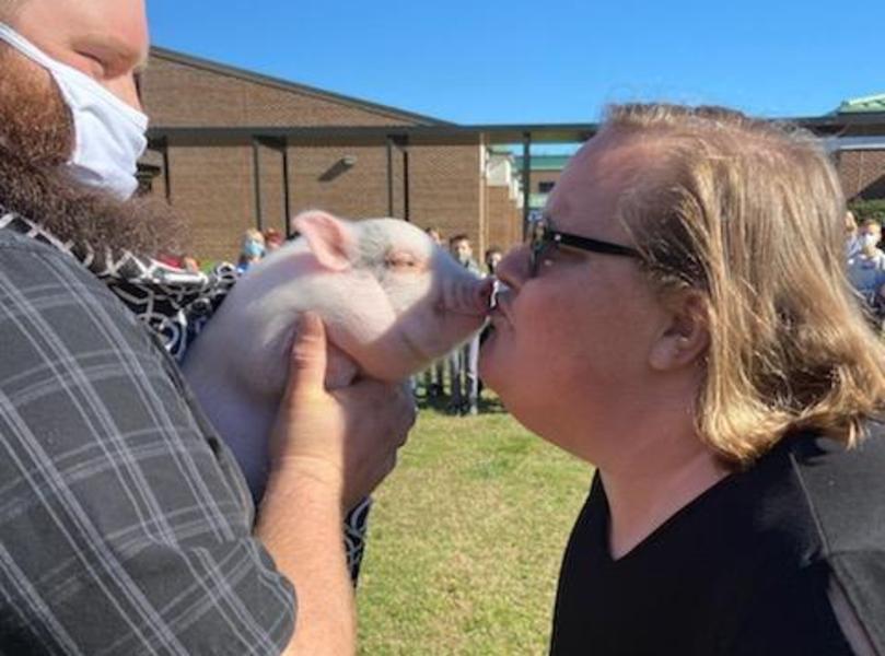 Dr. Reeder kisses the cutest piglet ever!