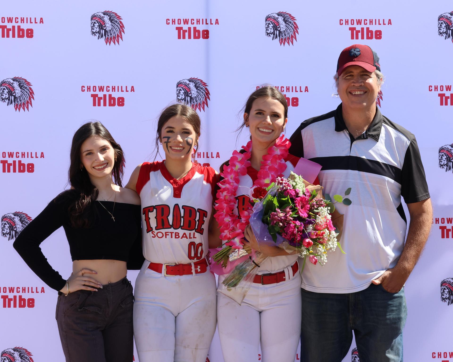 Seniors Posing With Teammates, Coaches, And Family