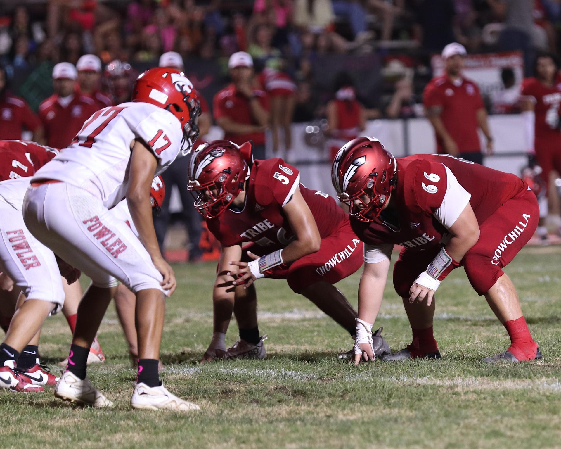 varsity boys playing football against Fowler