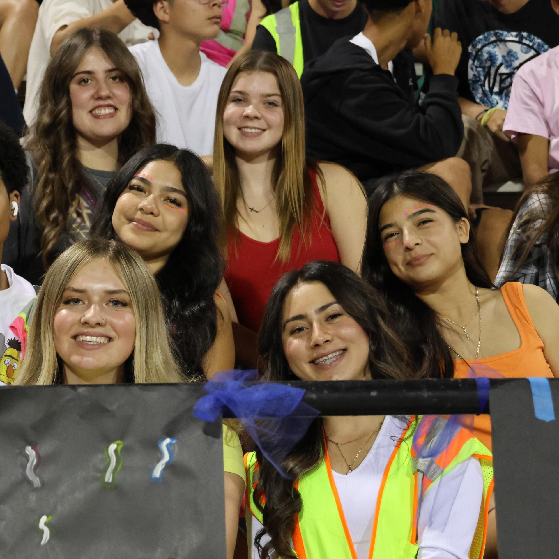 Students and community members enjoying the football game.