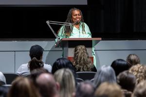 Michelle King speaks to the staff