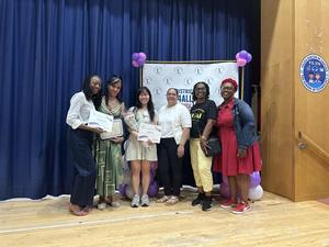 Staff members and Ms Marshall celebrating the team