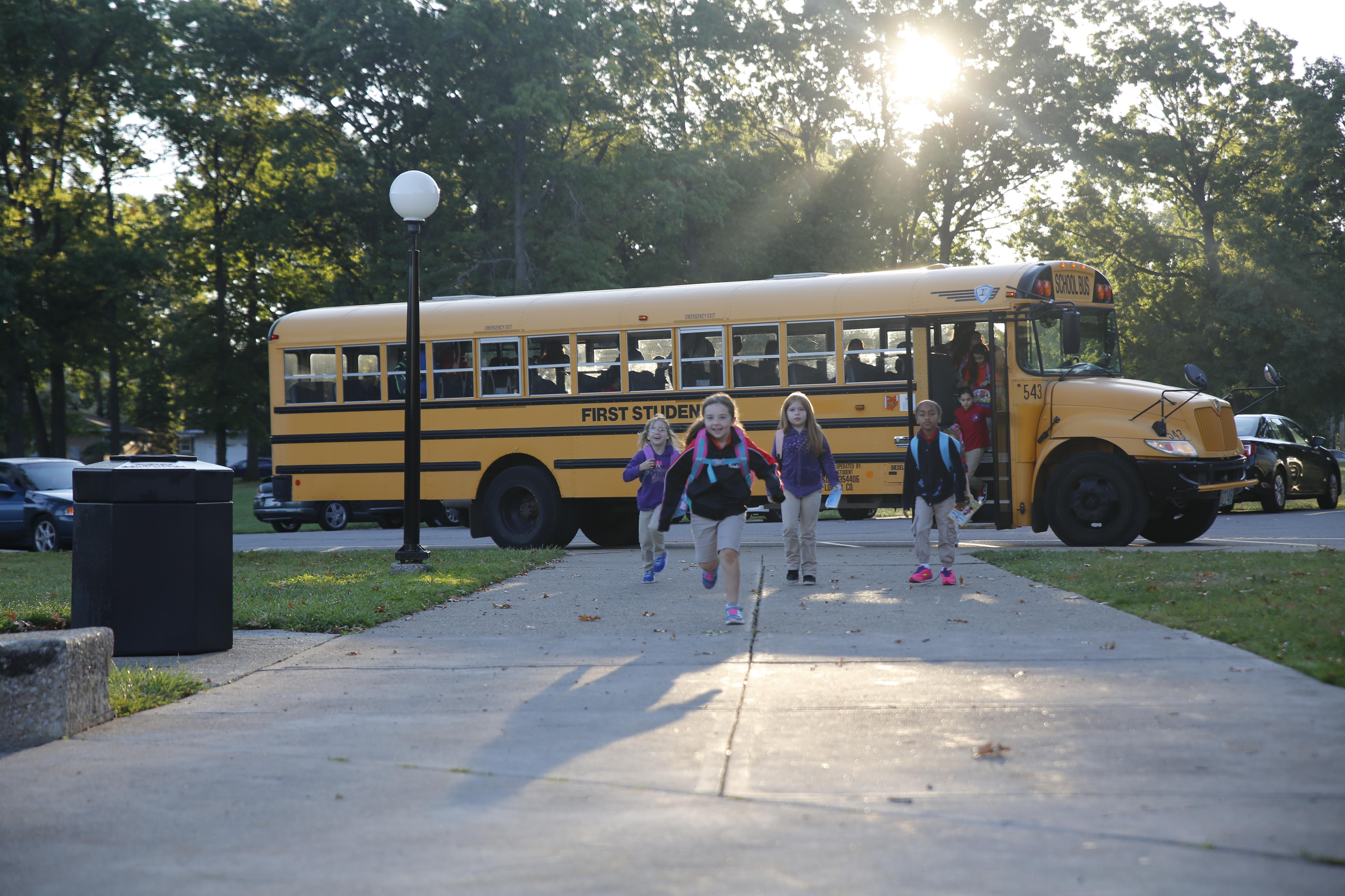 Students walking into a school building