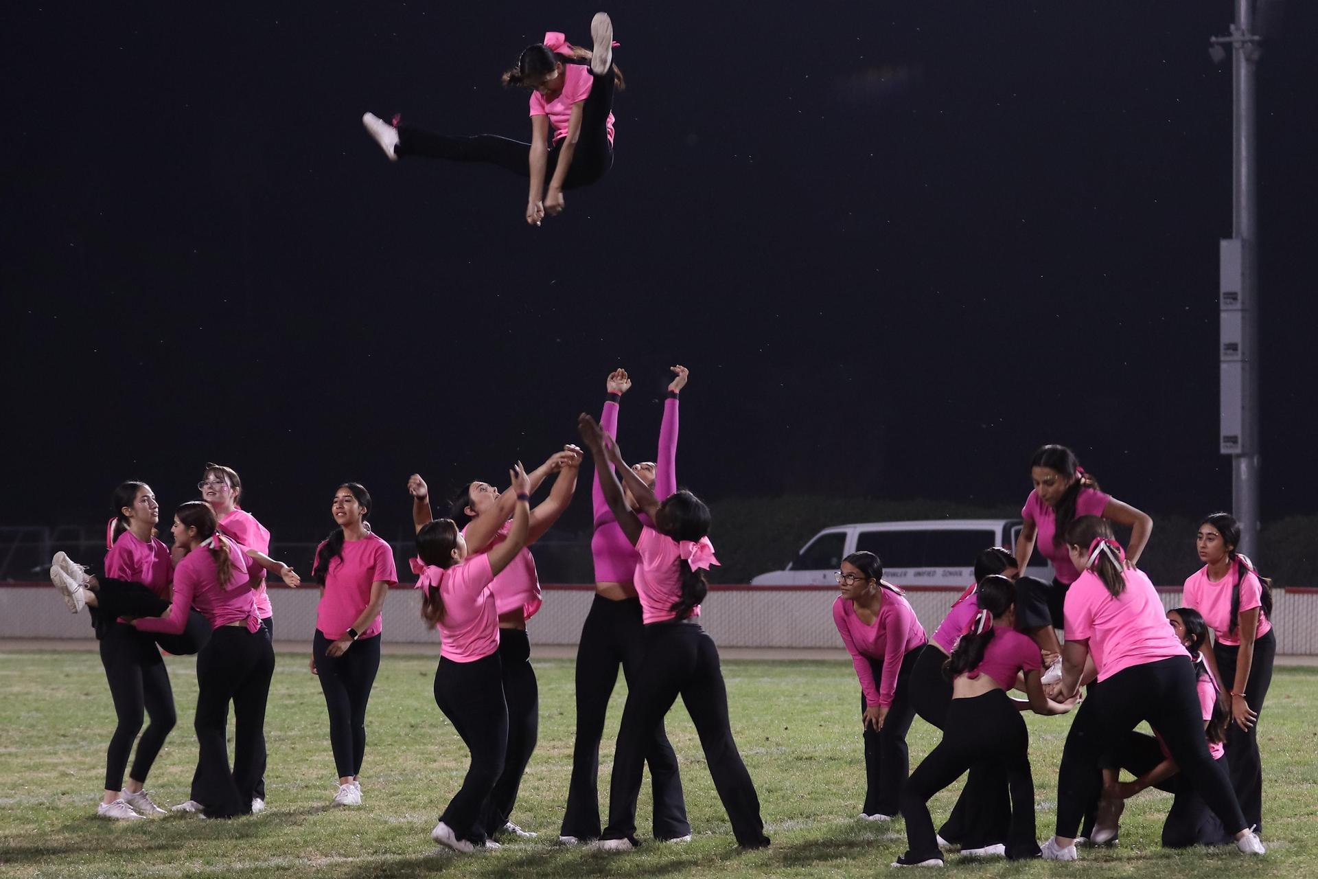 Varsity Cheer performing at halftime vs. Fowler