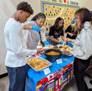 Students sampling Cachupa