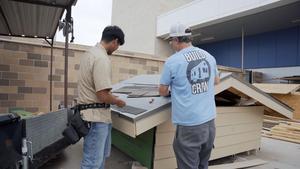 Stephen Bishop and a student discuss the Tiny House project