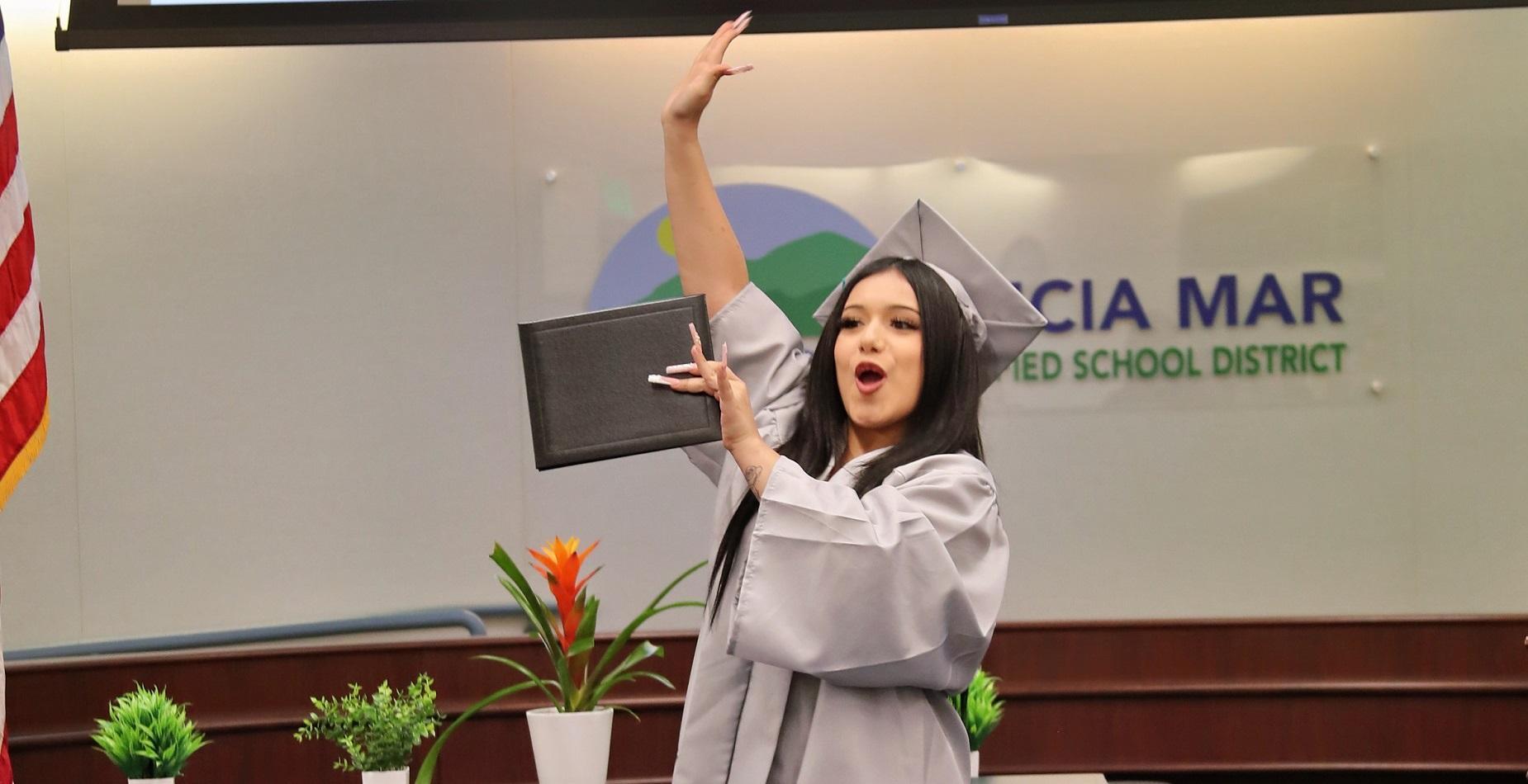 Lucia Mar Adult Education graduate Victoria celebrating her diploma at our June 2025 graduation ceremony.