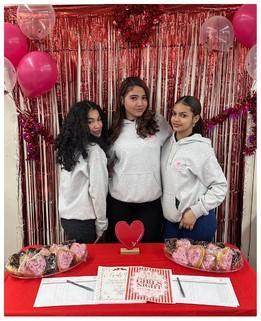 Three girls posing for a Girls Inc event