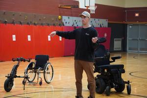 Addison Schipper shows students some of the adaptive technology available.