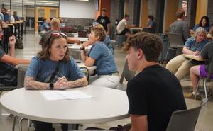 Chelsea Hall meets with her student athlete in the mentor program she helps organize and run.