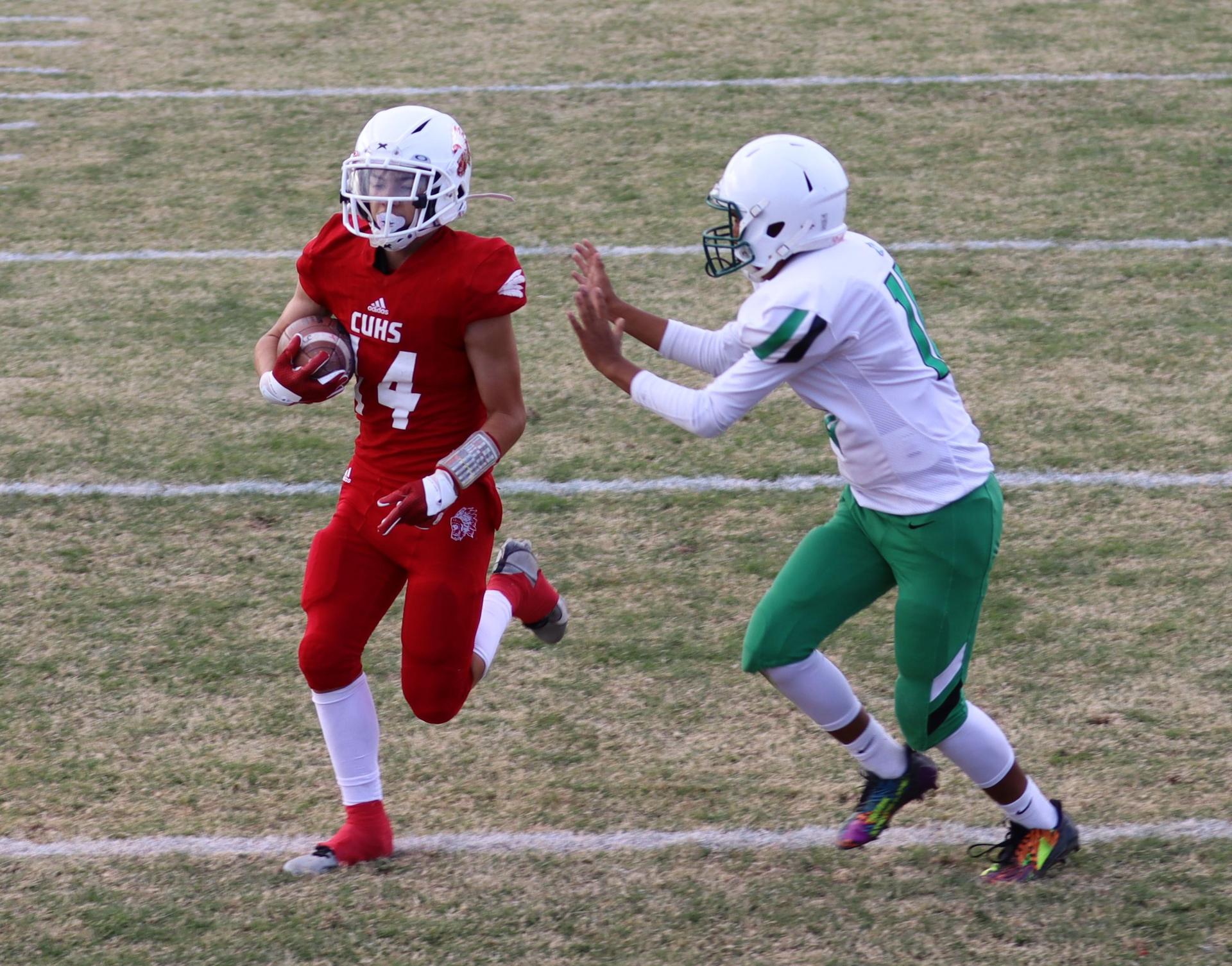  junior varsity football players in action against riverdale