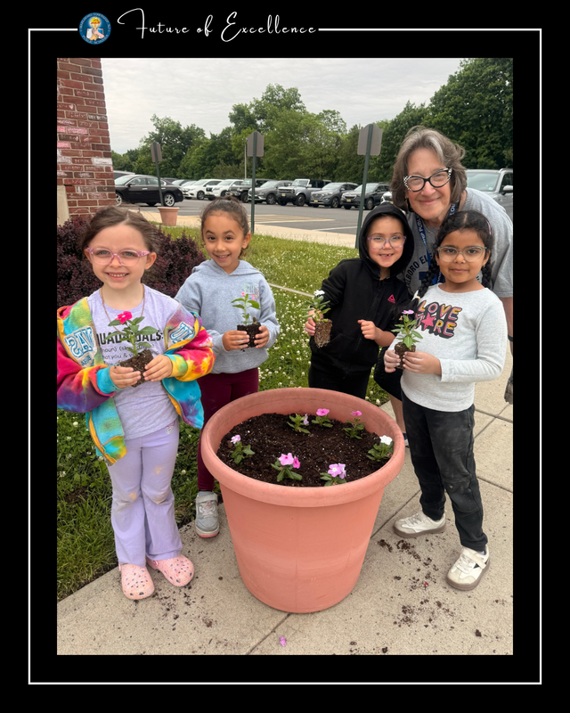 Kindergarten students planting flowers