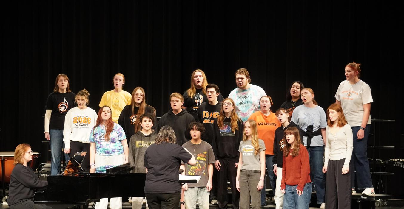 Honors choir members perform for elementary students.