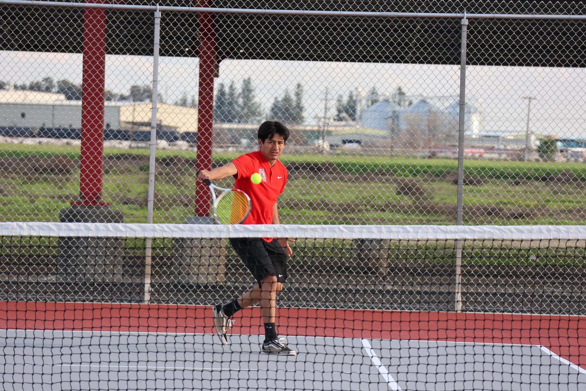 CUHS Boys playing tennis against coalinga