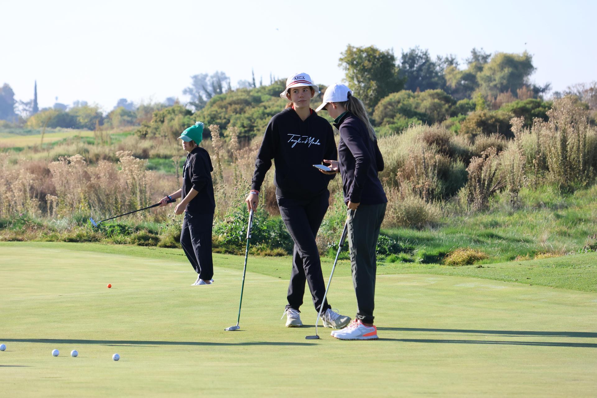 asterisk talley on the putting green before the match