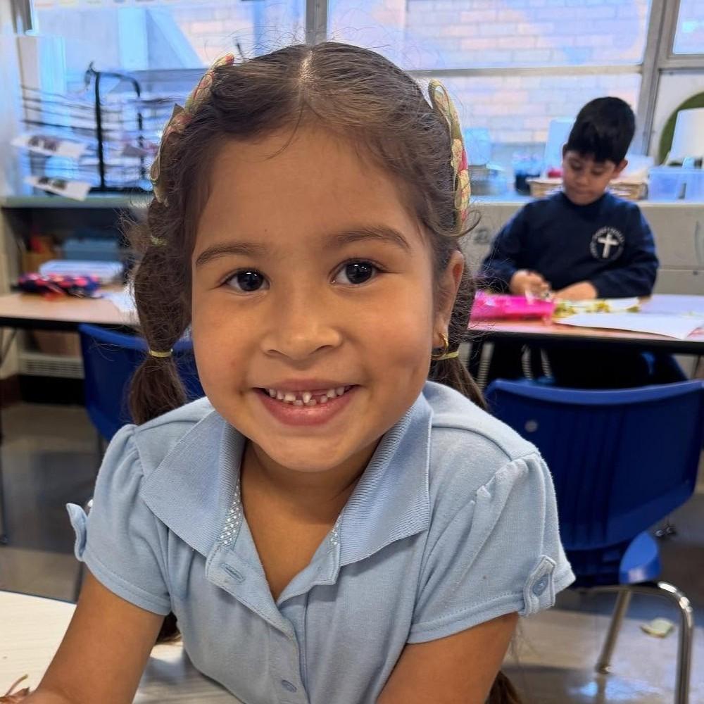 Hispanic student working in the classroom.