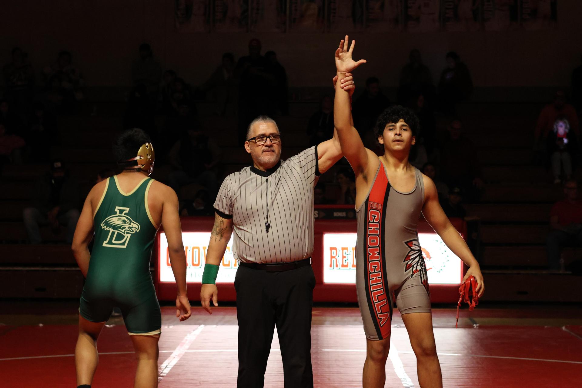Wrestling winners with hands up 130