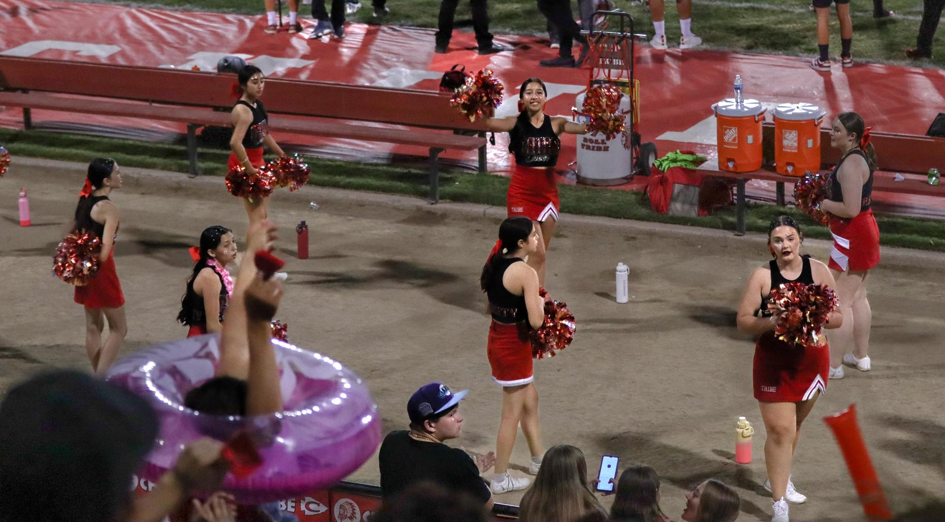 Varsity girls cheering at the Parlier football game