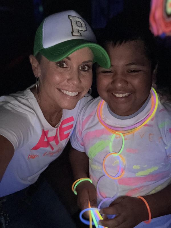 Students and staff at a glow in the dark fun run.