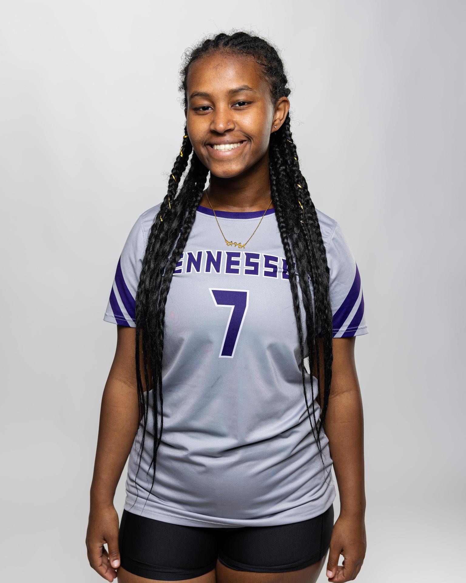 number 7 female volleyball player posing